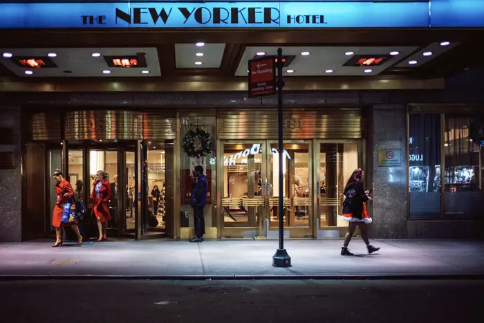 The New Yorker Hotel entrance at night